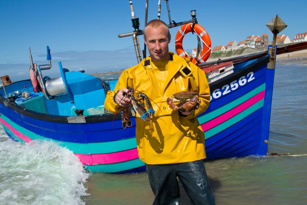 fisherman at Audresselles by his flobart traditional boat